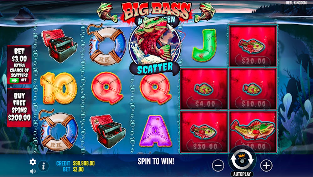 A colourful screenshot of the Big Bass Halloween online slot game by Reel Kingdom, featuring a spooky fishing theme. The reels display symbols such as fish, fishing gear, and bright Halloween-themed letters and numbers. The 