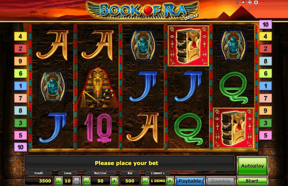 Screenshot of the Book of Ra Deluxe online pokie showing ancient Egypt-themed symbols on the reels with colorful paylines on the sides.