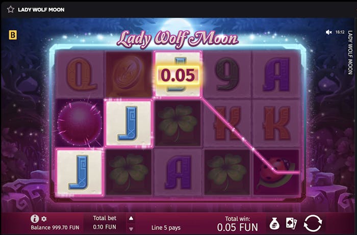 Lady Wolf Moon online pokie game showing a winning line with three 'J' symbols highlighted, a balance of 999.70 FUN, total bet of 0.10 FUN, and total win of 0.05 FUN.