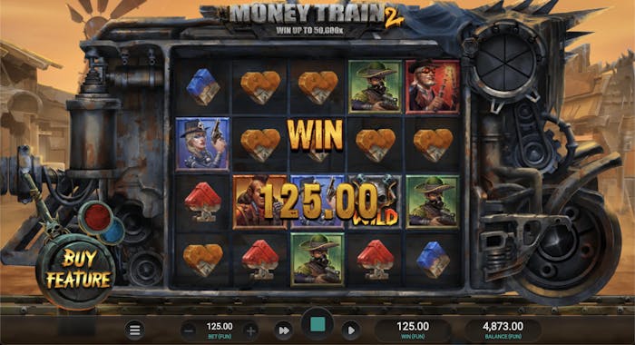 A Money Train 2 slot game screenshot showing a winning spin with a payout of 125.00. The reels display rugged outlaw characters, metal heart symbols, and a skull Wild icon, set against a worn, industrial train carriage in a dusty Wild West town. The
