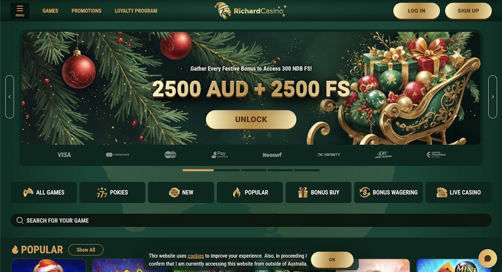 Richard Casino homepage featuring a festive theme with a green and gold sleigh filled with presents, promoting a bonus of 2500 AUD and 2500 free spins, with a menu for games, promotions, and loyalty programs.