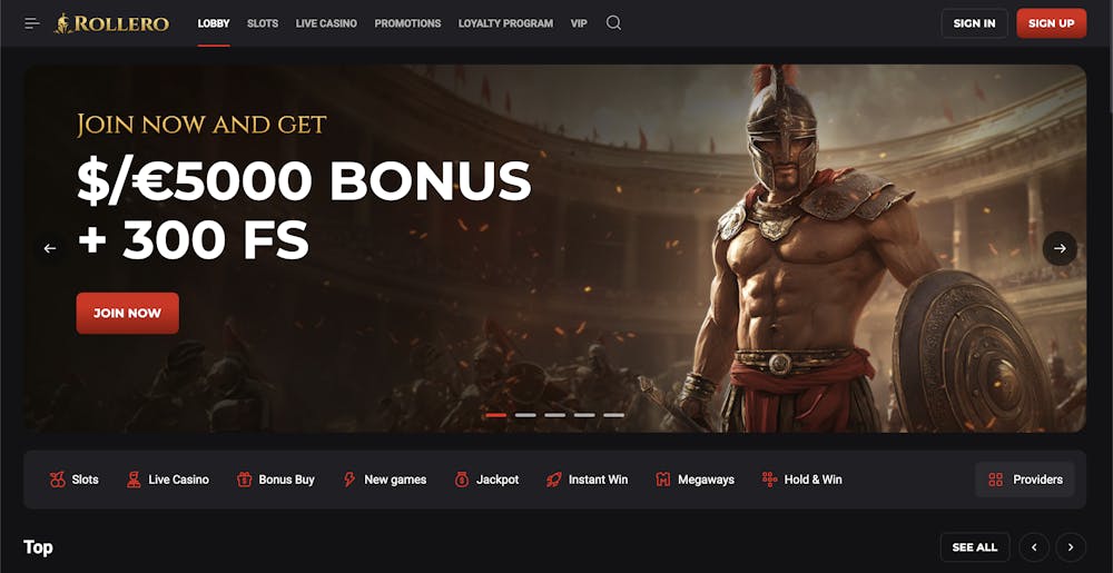 Rollero casino homepage featuring a bold welcome banner with a Roman gladiator, advertising a high-value bonus of up to $/€5000 and 300 free spins, with navigation to slots, live casino, promotions, and VIP program.