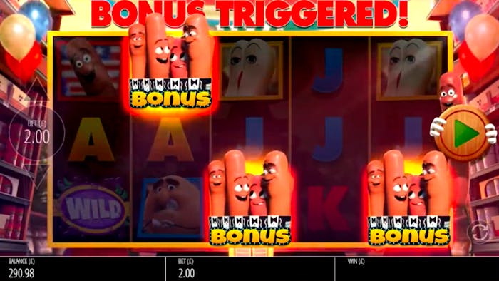 Sausage Party slot game reels featuring bonus symbols with animated sausages and a 'Bonus Triggered!' banner at the top.